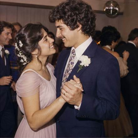 A couple dancing at a wedding reception in the 1970s